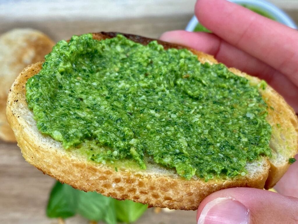 Homemade basil pesto on toasted bread