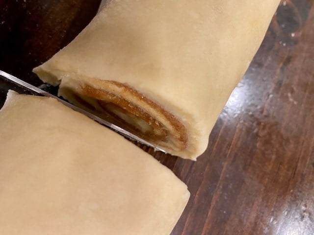 using a knife to cut the rolls