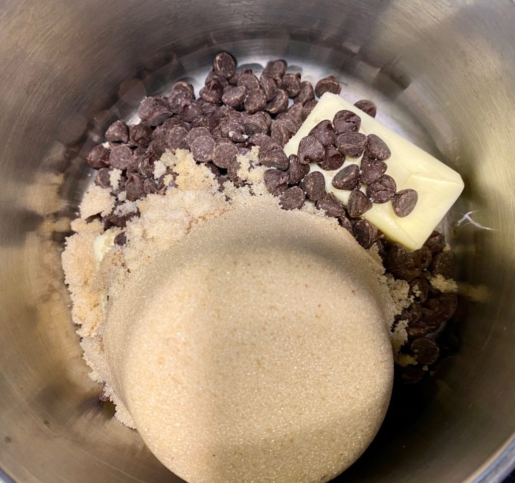 Melting brown sugar, chocolate chips and  butter to make chewy fudge brownie recipe